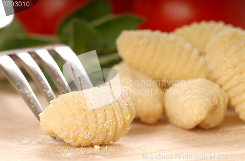 Image of Freshly made Gnocchi using a fork