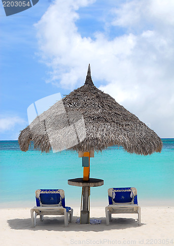 Image of Thatched hut on a white sand beach in Aruba