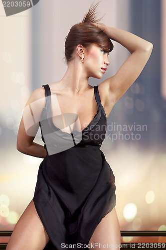 Image of woman in black dress ll