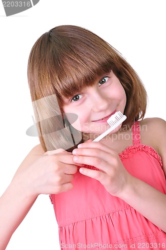 Image of girl brushing her teeth with a toothbrush