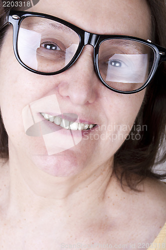 Image of smiling senior woman with glasses