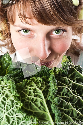 Image of woman and fresh savoy cabbage