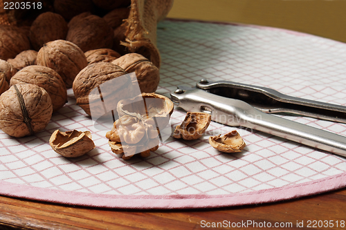 Image of Walnuts and Nutcracker on Table