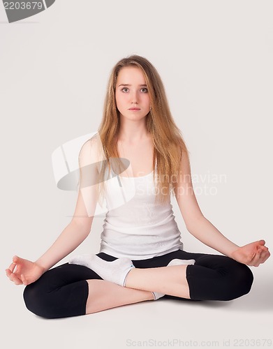 Image of Pretty girl doing meditation exercise