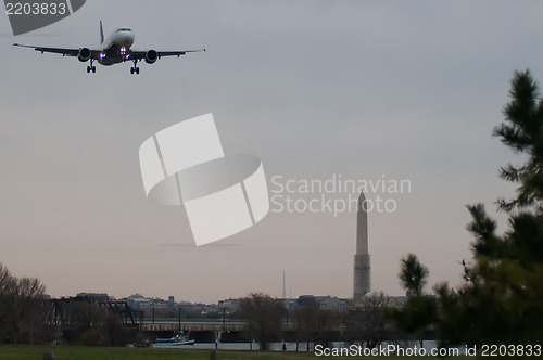 Image of airplane flying to airport washington dc