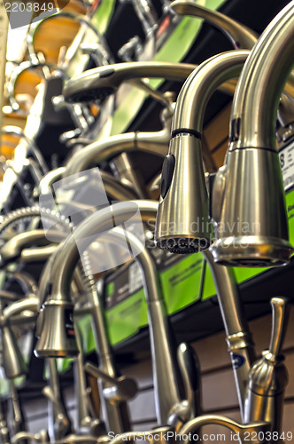 Image of rows of faucets on display for sale at store