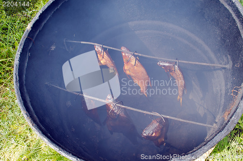 Image of healthy ecology fish smoke smokehouse rusty barrel 