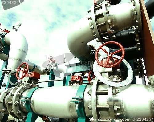 Image of Industrial zone, Steel pipelines and cables in green tones