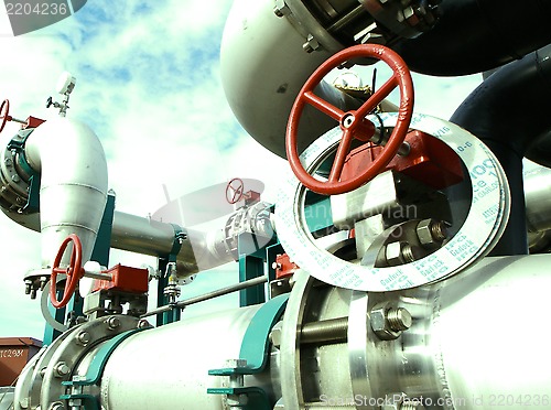 Image of Industrial zone, Steel pipelines and cables in green tones