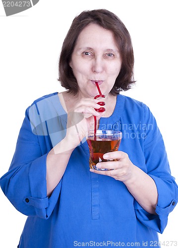 Image of elderly woman drinks juice