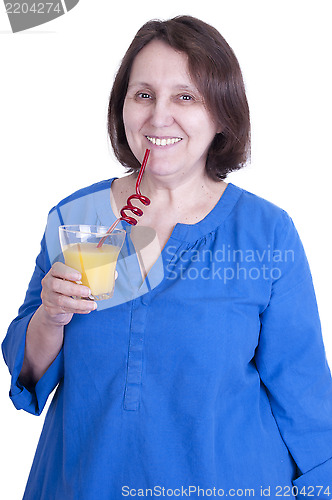 Image of elderly woman drinks orange juice