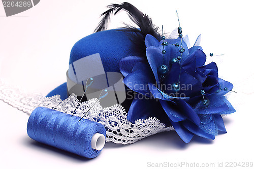 Image of Blue hat and white lace