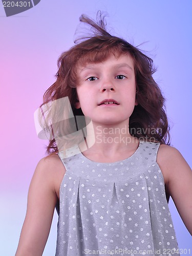 Image of  pretty 8 year old girl in silver dress