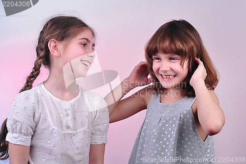 Image of happy laughing girls talking and having fun