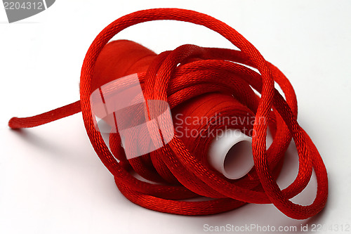 Image of Red threads and red band