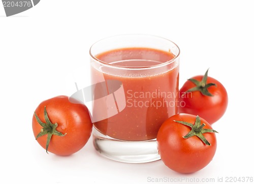 Image of Glass of tomato juice and tomatoes