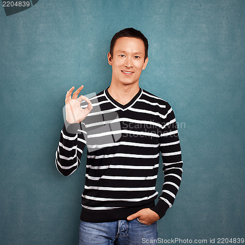 Image of Asian Man In Striped Pullover