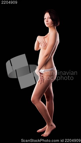 Image of topless woman body covering her breasts