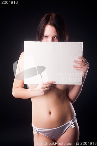 Image of sexy nude woman holding blank banner