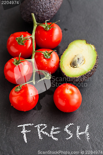 Image of Fresh tomatoes and avocados
