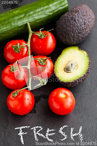 Image of Fresh tomatoes and avocados and cucumber