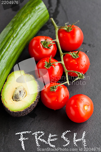 Image of Fresh tomatoes and avocado and cucumber