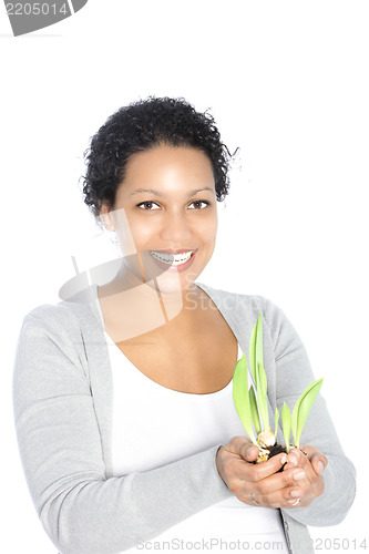 Image of Smiling woman with sprouting sping bulbs