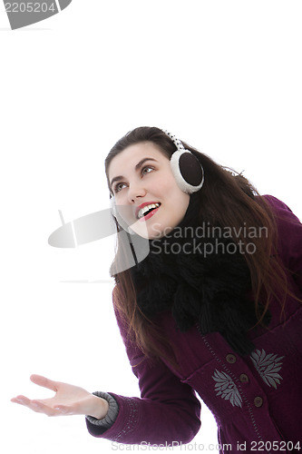 Image of Young attractive woman wearing ear muffs