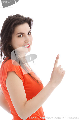 Image of Brunette young woman pointing up