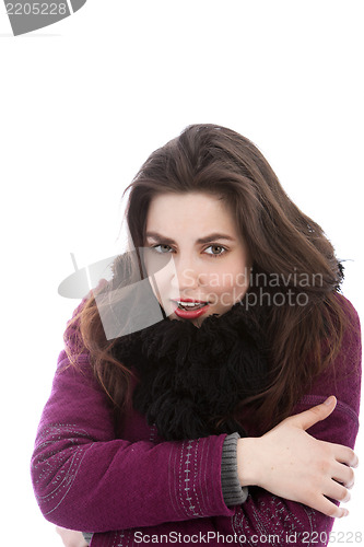 Image of Beautiful cold woman in winter clothing