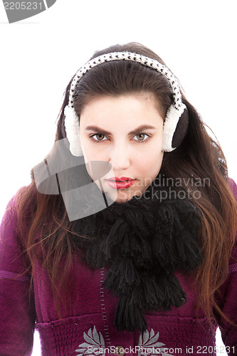 Image of Cold woman wearing ear muffs