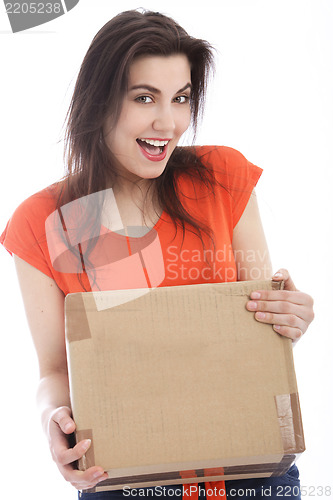 Image of Happy young woman holding a cardboard box