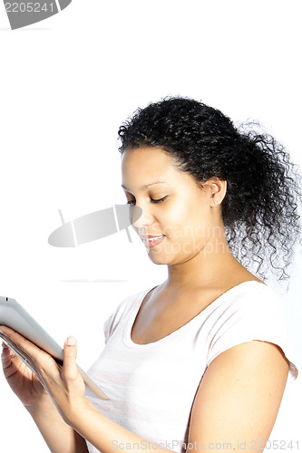 Image of Attractive woman reading her tablet screen