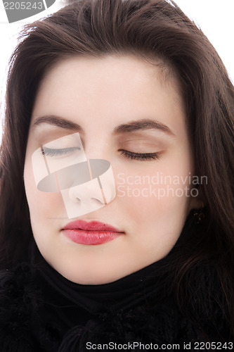 Image of Relaxed brunette woman with eyes closed, close up