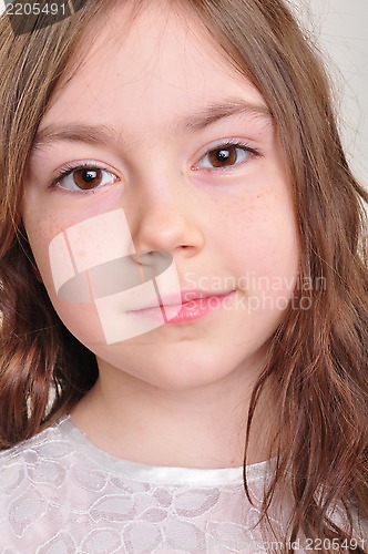 Image of pretty 8 year old girl in white dress