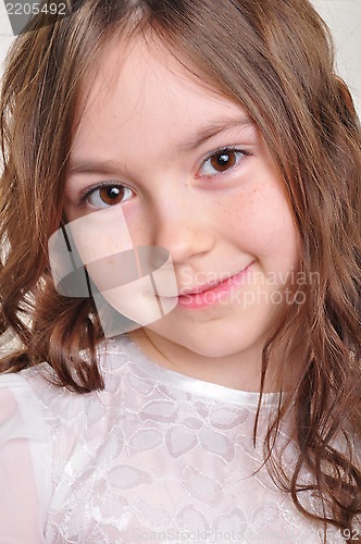 Image of pretty 8 year old girl in white dress