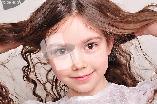 Image of pretty 8 year old girl in white dress