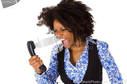 Image of Angry african american woman with handset