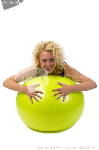 Image of Beautiful young woman with gym ball