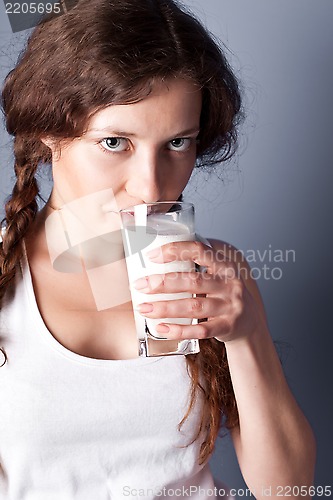 Image of woman enjoying a glass milk