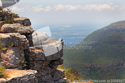 Image of Rocky ledge overlooking a mountain valley