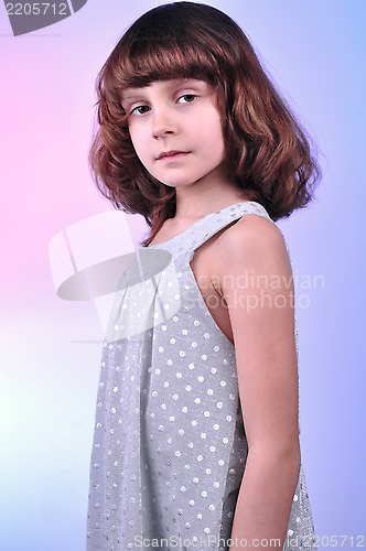 Image of  pretty 8 year old girl in silver dress