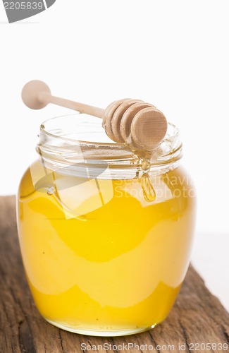 Image of Honey in bank on wooden boards