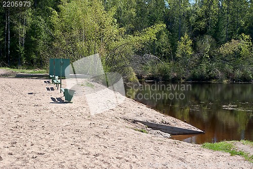 Image of Beach on the shore of the pond.