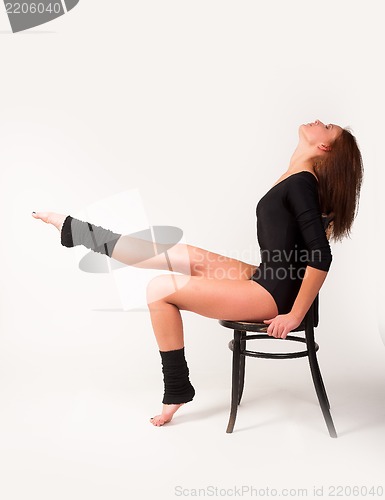 Image of Pretty brunette girl on chair