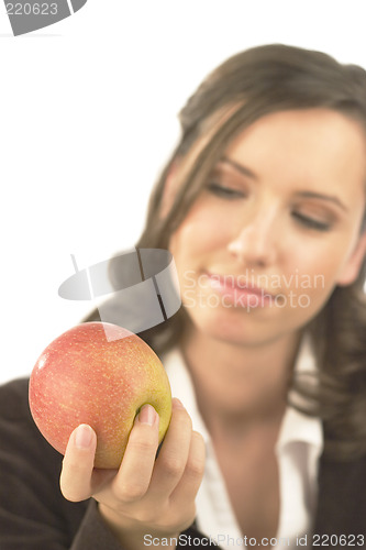 Image of Young woman with apple