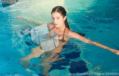 Image of Attractive girl in swimming pool