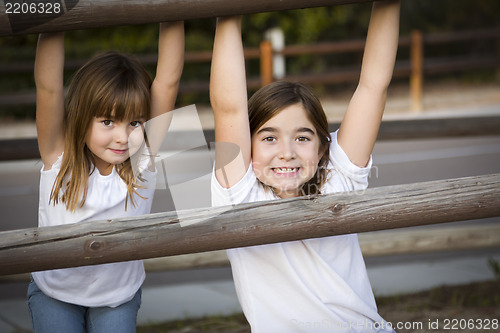 Image of Pretty Young Sisters Portrait Outside