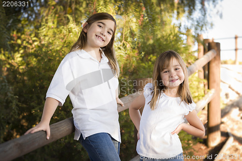 Image of Pretty Young Sisters Portrait Outside