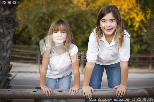 Image of Pretty Young Sisters Portrait Outside